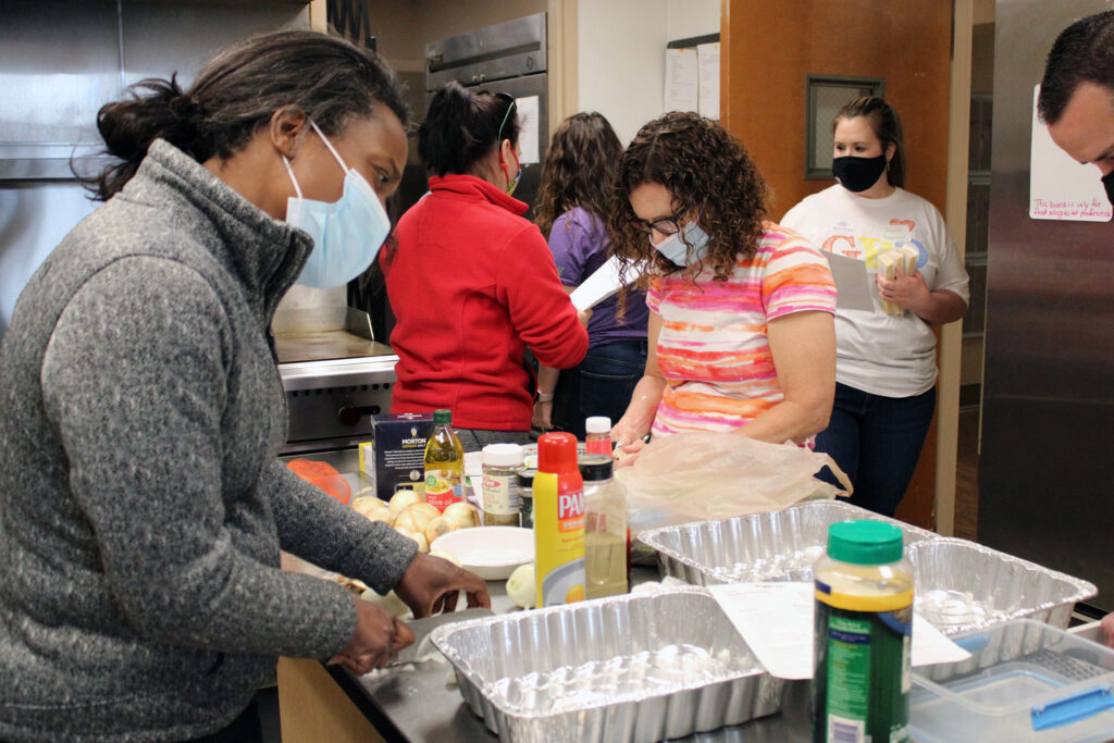 Volunteers prepare food at the ACCESS shelter