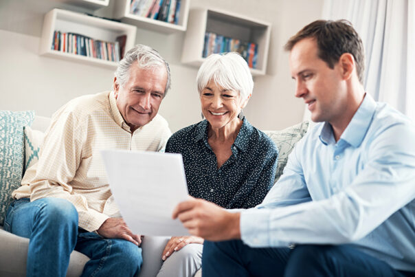 Older clients meeting with an advisor and smiling
