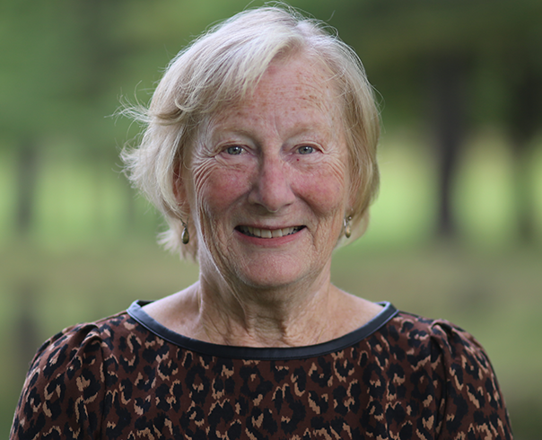 Barb Greene smiles in a headshot taken outside