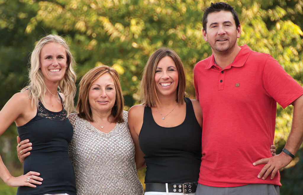 Founders and leaders of the Ben Curtis Family Foundation pose outside. 