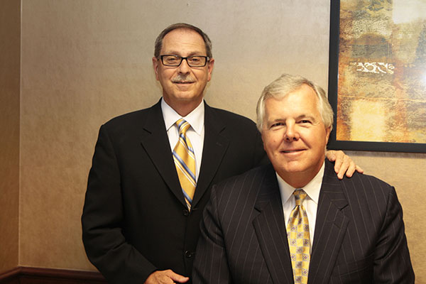 Two men smiling for a photo