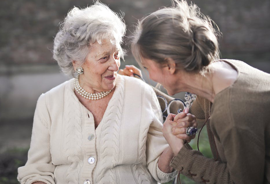 Older woman smiling at her daughter