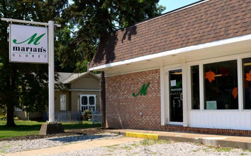 Brick building exterior with Marian's Closet sign