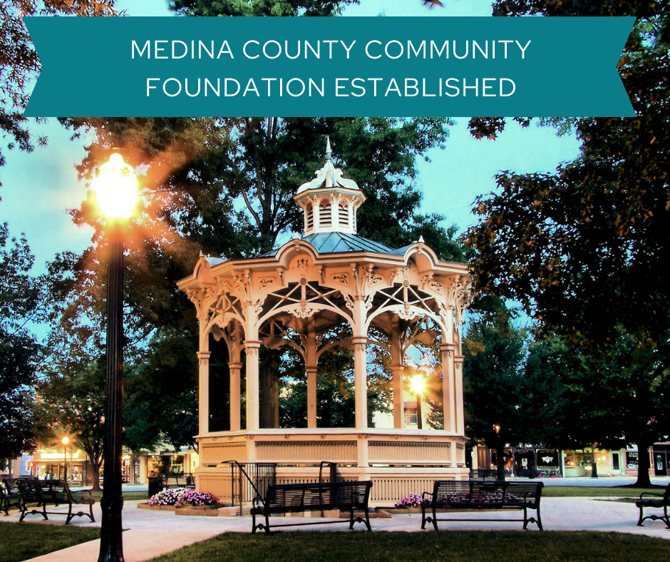 A white gazebo surrounded by trees at Uptown Park in Medina Square. There is text at the top of the photo that reads: "Medina County Community Foundation Established"
