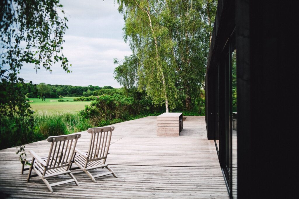 Scenic photo of porch overlooking a green landscape
