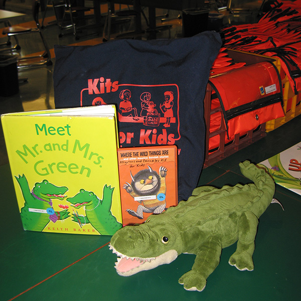 Stuffed alligator and books