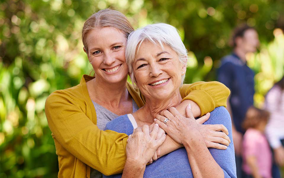 Daughter hugging mother