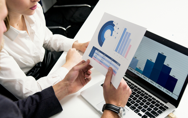 Two advisors examine charts