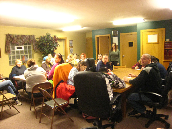 Group of teens gathered around tables