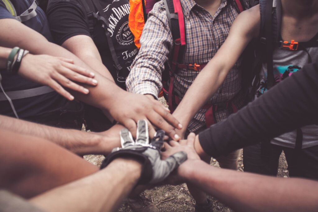 Hands piled together