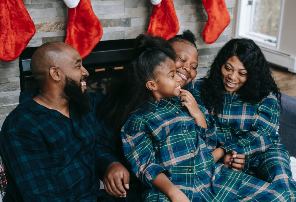 Black family wearing Christmas pajamas