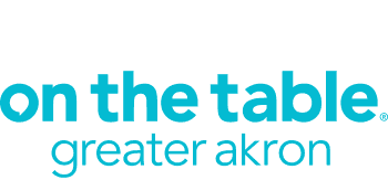 on the table greater akron logo