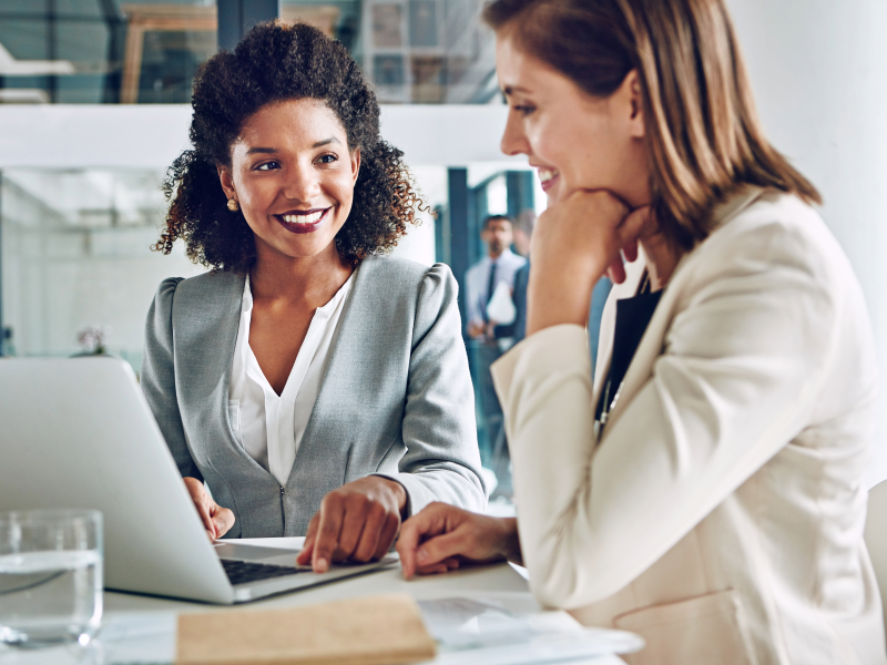 Advisor and client looking at a laptop together