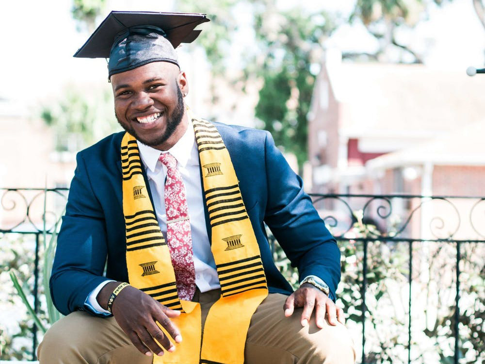 Student wearing graduation cap and gown