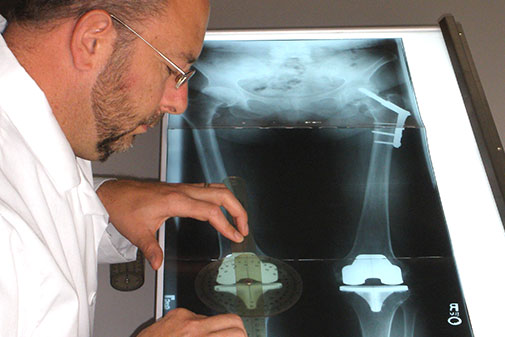Man examining X-Ray