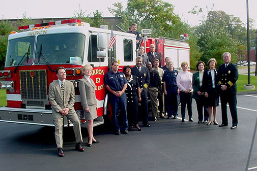 People gathered around a firetruck