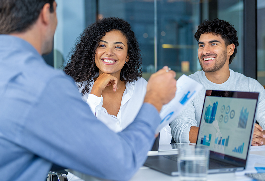 Younger couple meeting with financial advisor